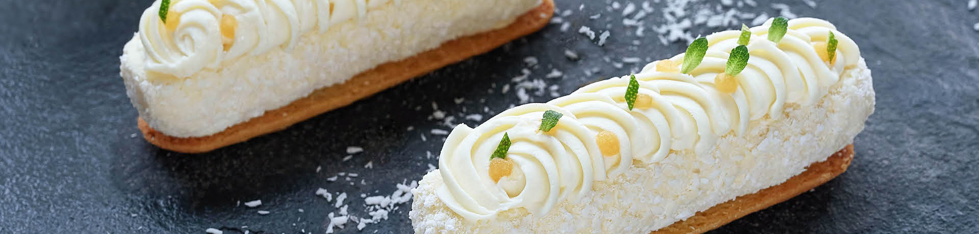 Two coconut and mango cheesecakes landscape