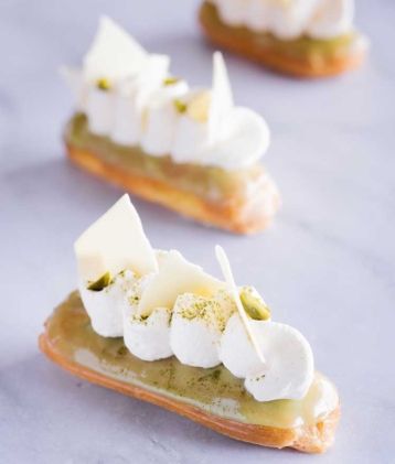 three matcha white eclairs on table