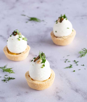 Three mushroom egg tartlet on table